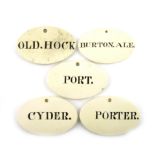 A collection of five early 19th century creamware bin labels, oval form, titled in black 'BURTON.