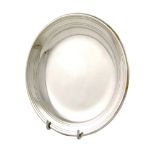 By Emile Puiforcat, a French silver dish, circular form, reeded borders, diameter 17.8cm, approx.