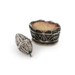 A George III silver filigree pin cushion, circa 1800, tapering oval basket form, length 3cm, plus