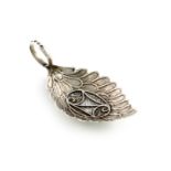 A George III silver caddy spoon, by Samuel Pemberton, Birmingham 1804, oval feather-shaped bowl,