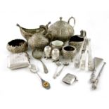 A mixed lot of silver items, comprising: an Indian teapot and cream jug, of circular form, chased