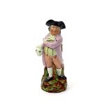 A Hearty Good Fellow Toby jug, c.1810, standing with one foot slightly behind him, holding his