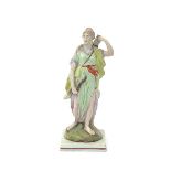 A large Staffordshire figure of Diana, c.1790-1800, standing before a tree stump and taking an arrow