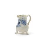 A salt-glazed stoneware Scratch Blue milk jug, c.1750, engraved and coloured with a leafy