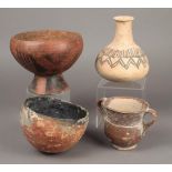 Four pottery vessels including a Mari globular vessel with a tapering neck with painted linear