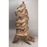 A Middle Sepik woman's rainhood Papua New Guinea woven fibre, rectangular and stitched along one