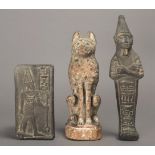 An Egyptian wood seated cat with a white ground and painted spots, 16.5cm high, a shabti and a