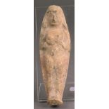 A Phoenician terracotta figure of Tanit moulded standing with a headdress and long hair and with her