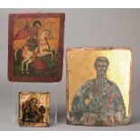 A Russian icon wood and painted St John in Silence, with an angel on one shoulder and a bird on