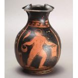 An Apulian red-figure oinochoe Greek the front with a painted panel with a naked male holding a