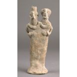 A Syro-Hittite clay double headed idol probably circa 1500 BC with large necklaces and with hands on