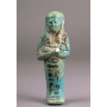 An Egyptian turquoise faience shabti Third Intermediate Period, circa 1080 - 945 BC with a painted