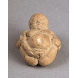 A Hellenistic terracotta figure of Baubo represented as a fat woman with her legs raised back and