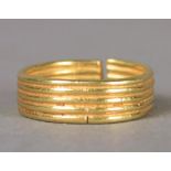 A late Bronze Age gold ring circa 1200 - 600BC the interior and exterior with five encirling ribs,