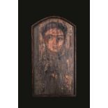 A Romano-Egyptian fayum portrait of a young man circa 1st - 2nd century AD and later painted on