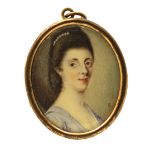 λ English School late 18th Century Portrait miniature of a lady, bust length wearing a purple