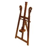 A small 20th Century wooden easel with swan neck tops 81cm; 32in high