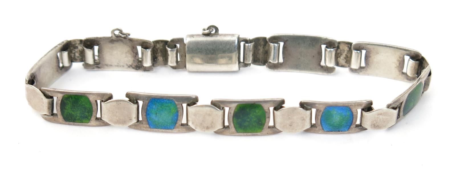 A James Fenton silver and enamel link bracelet, each rectangular panel with blue and green enamel