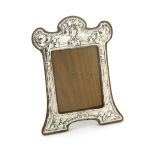 An Arts and Crafts Albert Jackson silver photograph frame, stamped in low relief with stylised