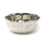 An Austrian silver bowl, the faceted bowl with hammered finish, stamped marks, for 1922, 21cm. diam.