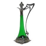 An Art Nouveau W.M.F pewter and glass claret jug, tapering green glass body inside pewter mount cast