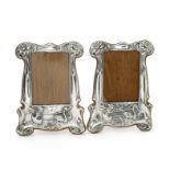 A pair of silver plated on copper photograph frames,
