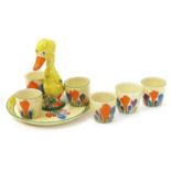 'Crocus' a Clarice Cliff Bizarre Duck egg cruet set, comprising tray and six egg cups, all painted