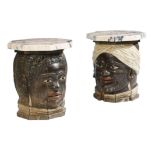 A pair of Portuguese carved wood and painted Moor head occasional tables, each with a later