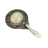 A Chinese copper and jade hand mirror, the mirror back decorated with semi-precious stone cabochons,