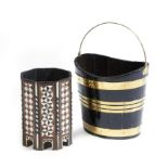 λ A 19th century stained wood and brass bound navette shaped peat bucket, with a swing handle,