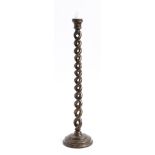 An aubergine lacquer spiral twist candlestick, with gilt decoration of flowers and leaves, 50cm
