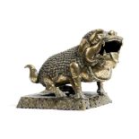 A 19th century Chinese polished bronze model of a Buddhist lion dog, 19.3cm high, 27cm long.
