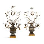A pair of French gilt metal and glass candelabra attributed to Maison Baguès, in the form of an