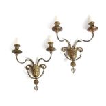A pair of Adam style gilt brass wall lights, with scroll branches and urn nozzles, with leaf and