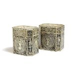 A pair of painted wood tea caddies in Regency style, of canted form, each with a hinged lid