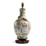 A 19th century Chinese Canton porcelain table lamp, with a celadon ground painted with panels of