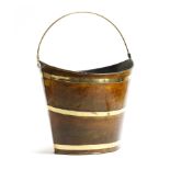 A brass and tôle navette shape peat bucket, painted to simulate wood, probably late 19th century,