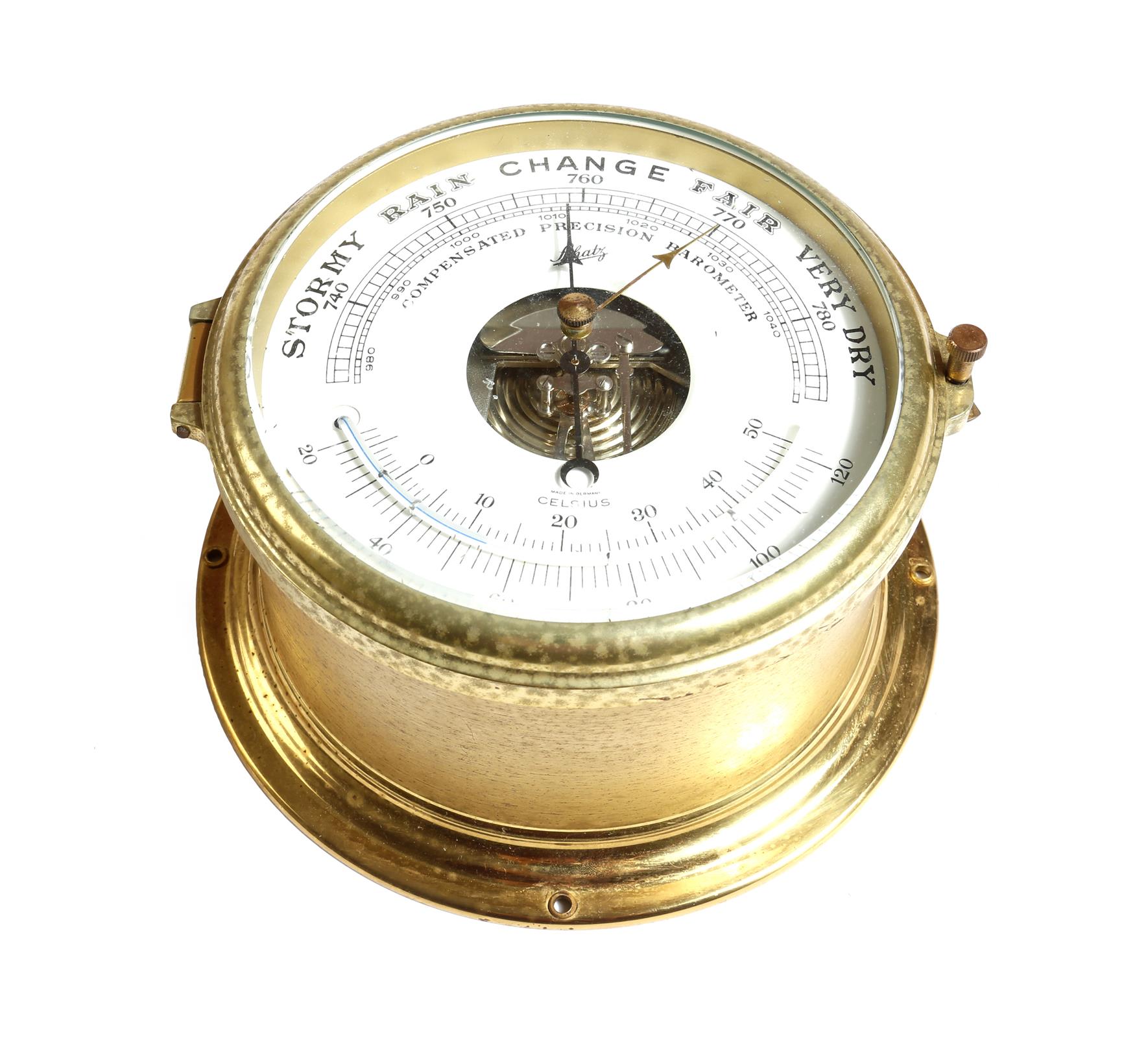 A German brass cased bulkhead style aneroid barometer by Schatz, with thermometer, 18cm diameter.