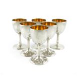 A set of six Thai metalware goblets marked Sterling, Thailand, tapering circular bowls, gilded