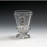 A Baccarat cut glass beaker, 19th century, cut with eight sides, one enamelled with a full length