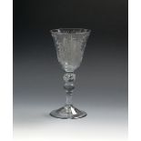 A Dutch-engraved East India Company baluster goblet, c.1750, the round funnel bowl engraved with a