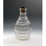 A cut glass magnum decanter and stopper, 19th century, of mallet shape, cut with bands of hobnail