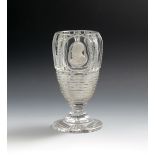 A cut glass sulphide goblet, 19th century, the tall rounded bowl cut with vertical bands above a