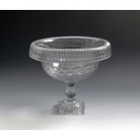 An Irish cut glass pedestal bowl, c.1800, with a turnover rim cut with vertical flutes, the bowl