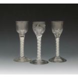 Three small wine glasses, c.1760-70, with round funnel bowls, one moulded with flutes, one