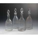 Three moulded glass decanters and stoppers, c.1800, one with spiral flutes and engraved 'Rne Bi'