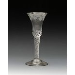 An engraved wine glass, c.1760-70, the bell bowl raised on a thick airtwist stem above a conical