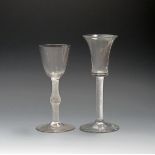 Two wine glasses, c.1760-70, one with a waisted bucket bowl raised on a dense airtwist stem, the