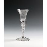 A wine glass of Jacobite significance, c.1760, the bell bowl engraved with a rose and bud spray