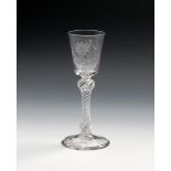 A good wine glass, c.1770, the bucket bowl engraved with a sunflower and a bee, raised on a double-